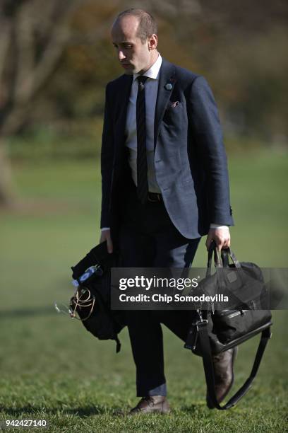 White House Senior Advisor Stephen Miller walks across the South Lawn after arriving back at the White House April 5, 2018 in Washington, DC. Miller...