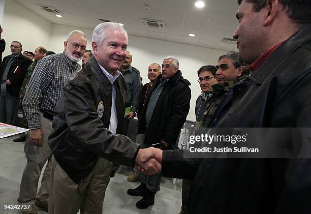 Secretary of Defense Robert Gates meets with members of the Afghan Army before boarding a plane at Kabul International Airport December 10, 2009 in...