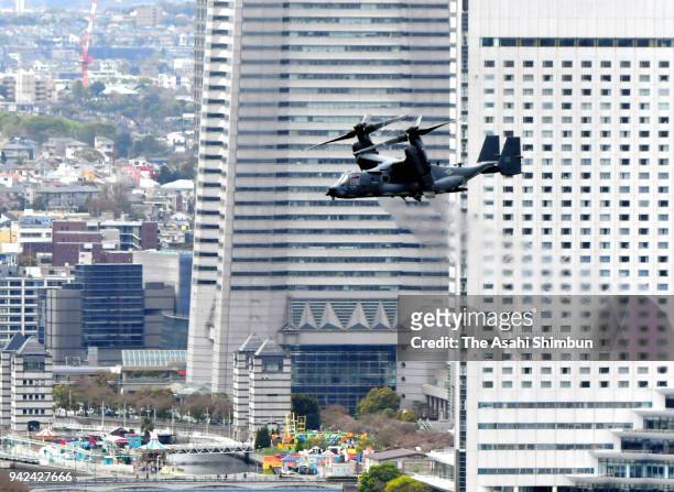 In this aerial image, a CV-22 Osprey flies past Minato Mirai commercial and residential district on April 5, 2018 in Yokohama, Kanagawa, Japan. The...