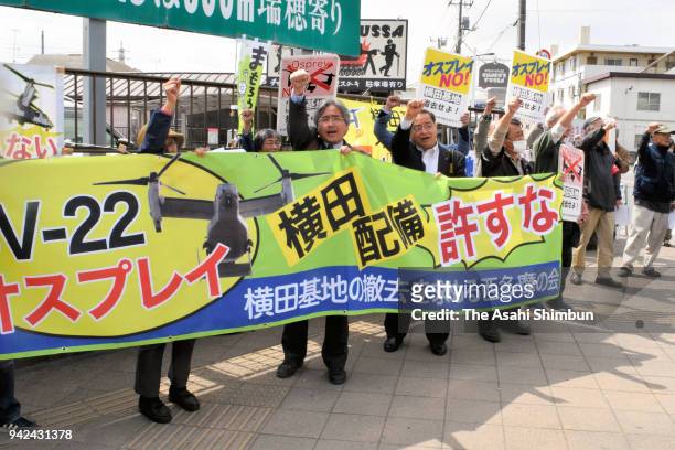 Protesters shout their slogans outside the Yokota Air Base as CV-22 Ospreys are deployed on April 5, 2018 in Fussa, Tokyo, Japan. The transport...