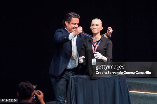 Aristoteles Sandoval Governor of Mexican State of Jalisco puts a necklace on robot Sophia during the Robot Sophia Master Conference as part of the...