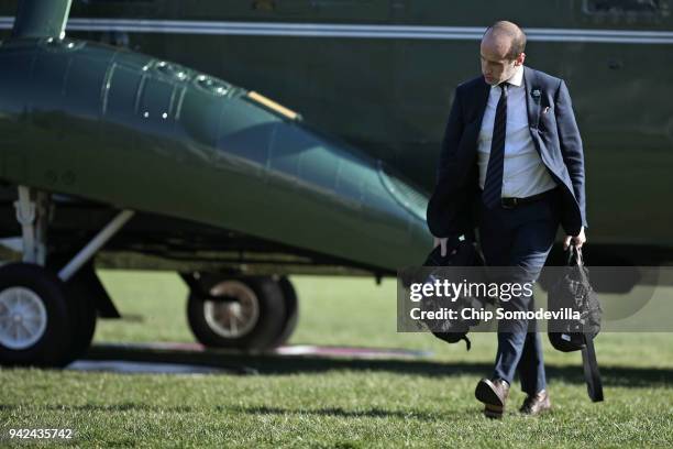 White House Senior Advisor to the President Stephen Miller walks across the South Lawn after arriving back at the White House April 5, 2018 in...