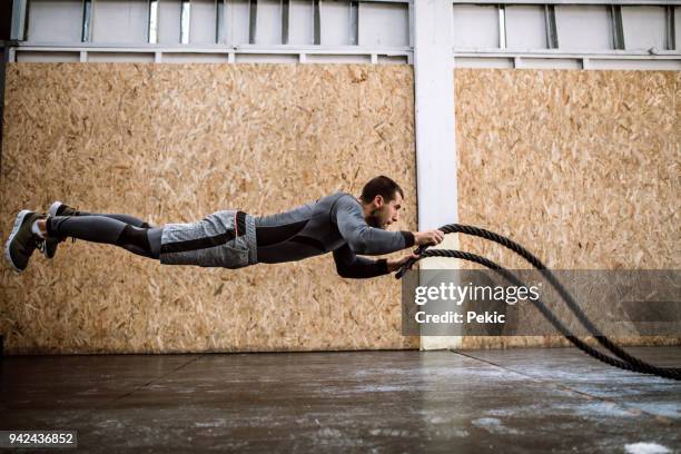 real life superhero - battle rope stock pictures, royalty-free photos & images