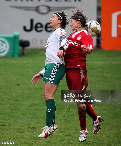 Bianca Rech of Bayern in action with Annike Krahn of Duisburg during the Women's Bundesliga match between FCR 2001 Duisburg and FC Bayern Muenchen at...