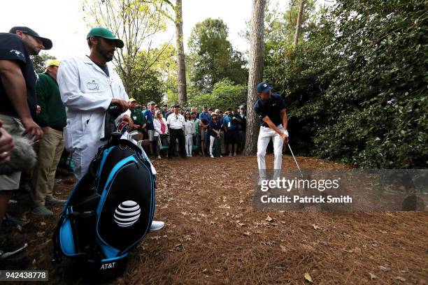 Jordan Spieth of the United States plays his second shot on the 18th hole during the first round of the 2018 Masters Tournament at Augusta National...