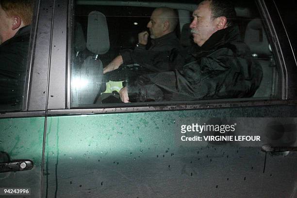 Police car carrying Nicolas Willot, the stepfather of missing believed dead French girl Typhaine drives away from the 'Centre de Delassement' in...