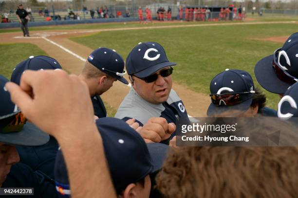 April 4: Brooks Roybal of Columbine High School baseball team and the players huddle before the game against Heritage High School at Columbine High...