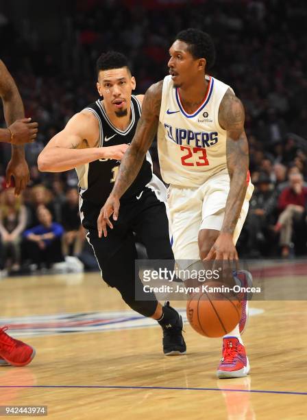 Danny Green of the San Antonio Spurs defends Lou Williams of the Los Angeles Clippers as he takes the ball down court in the game at Staples Center...