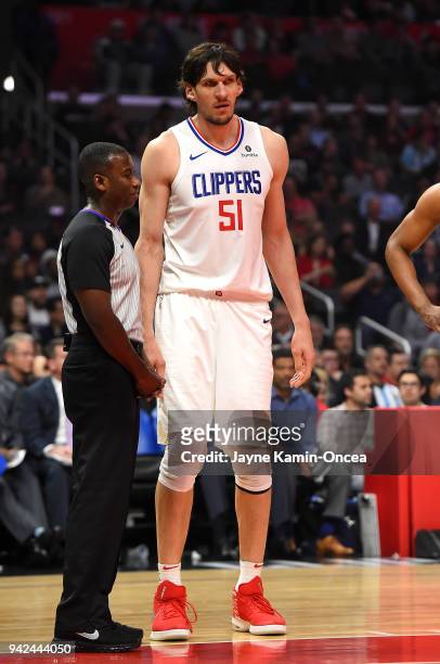 Boban Marjanovic of the Los Angeles Clippers talks with referee James Williams during the game against the San Antonio Spurs at Staples Center on...