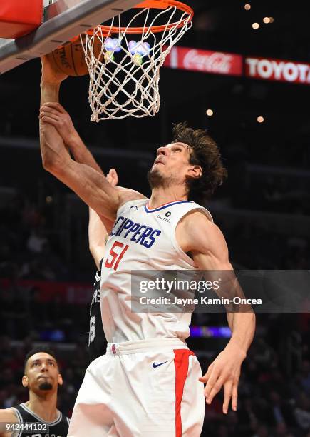 Pau Gasol of the San Antonio Spurs defends a shot by Boban Marjanovic of the Los Angeles Clippers in the second half of the game at Staples Center on...