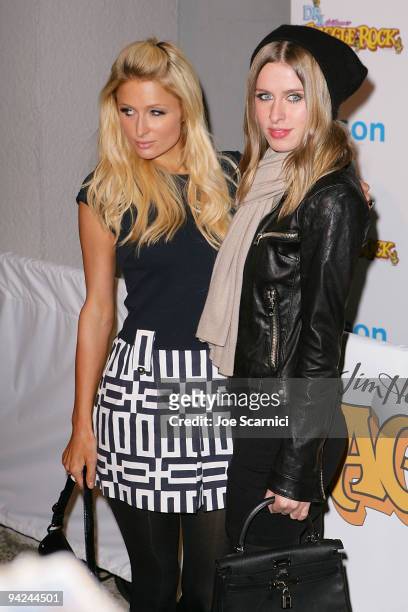Paris and Nicky Hilton arrive at the Jim Henson Company's "Fraggle Rock" Holiday Toy Drive Benefit at Kitson on Robertson on December 9, 2009 in...