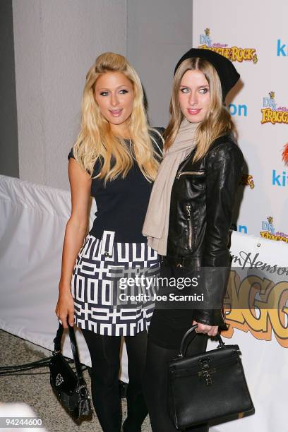 Paris and Nicky Hilton arrive at the Jim Henson Company's "Fraggle Rock" Holiday Toy Drive Benefit at Kitson on Robertson on December 9, 2009 in...