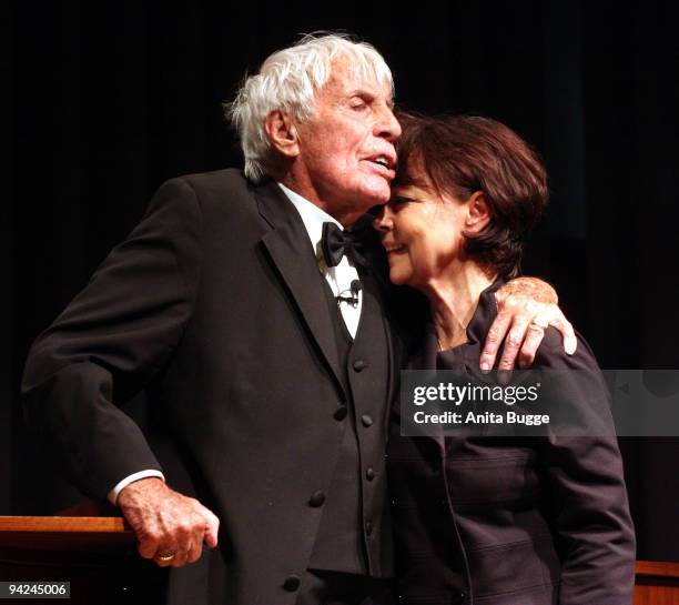 Dutch-born entertainer Johannes Heesters, who is 104 and blind, holds his wife Simone Rethel-Heesters as he sings for the opening of the exhibiton...