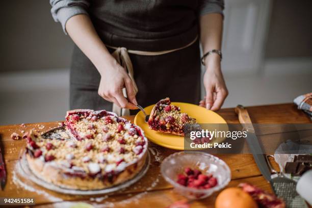 slicing pieces of tasteful blackberry pie - cake pie stock pictures, royalty-free photos & images