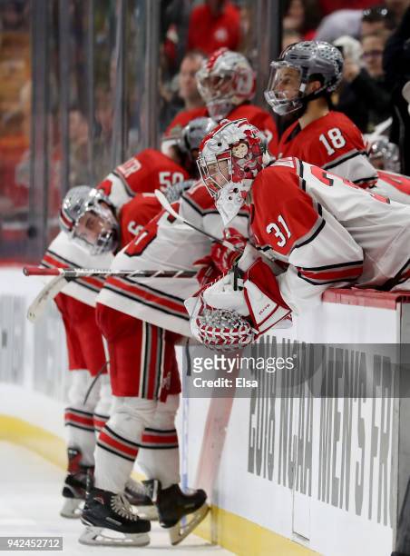Evan Moyse of the Ohio State Buckeyes and the rest of the bench react to the loss tot the Minnesota-Duluth Bulldogs during the semifinals of the 2018...