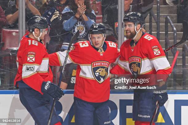 Aleksander Barkov celebrates his first period goal with Aaron Ekblad and Evgeni Dadonov of the Florida Panthers against the Boston Bruins at the BB&T...
