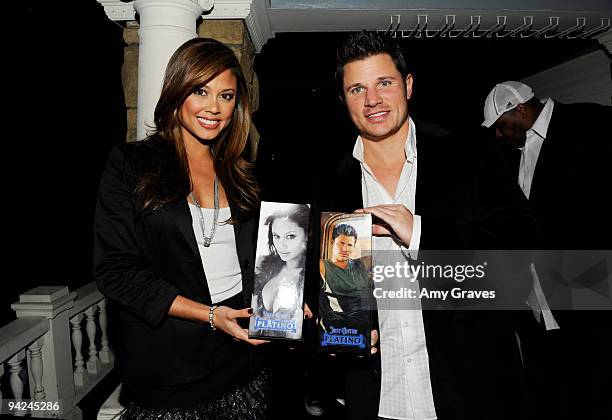 Vanessa Minnillo and Nick Lachey hold personalized bottles of Jose Cuervo Platino during the 944 Magazine Jose Cuervo Platino Masters of the Mix...