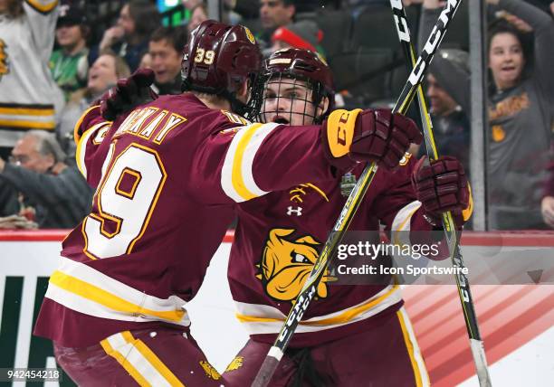 Minnesota-Duluth Bulldogs defenseman Louie Roehl celebrates his 1st period goal with Minnesota-Duluth Bulldogs forward Parker Mackay during a Frozen...