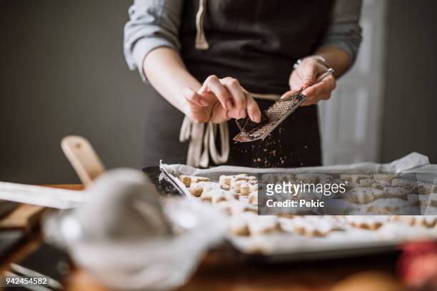 a spice of dark chocolate on fresh cookies - grater stock pictures, royalty-free photos & images