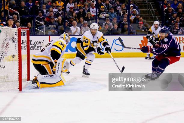 Boone Jenner of the Columbus Blue Jackets beats Matt Murray of the Pittsburgh Penguins for a power play goal during the second period on April 5,...