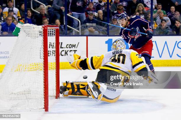 Matt Murray of the Pittsburgh Penguins makes a save against Josh Anderson of the Columbus Blue Jackets during the second period on April 5, 2018 at...