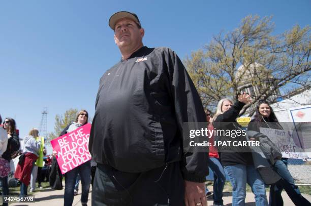 Scott Teel walks the picket line during a teachers rally at the state capitol in Oklahoma City, Oklahoma on April 4, 2018. Buoyed by a nine-day...