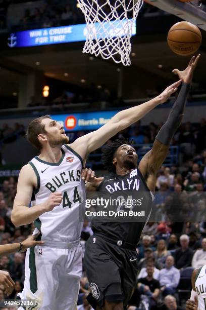 Rondae Hollis-Jefferson of the Brooklyn Nets attempts a shot while being guarded by Tyler Zeller of the Milwaukee Bucks in the second quarter at the...