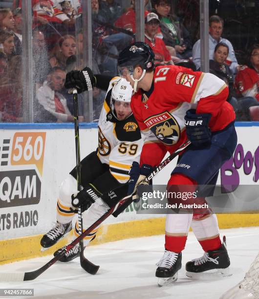 Mark Pysyk of the Florida Panthers defends against Tim Schaller of the Boston Bruins during second period action at the BB&T Center on April 5, 2018...