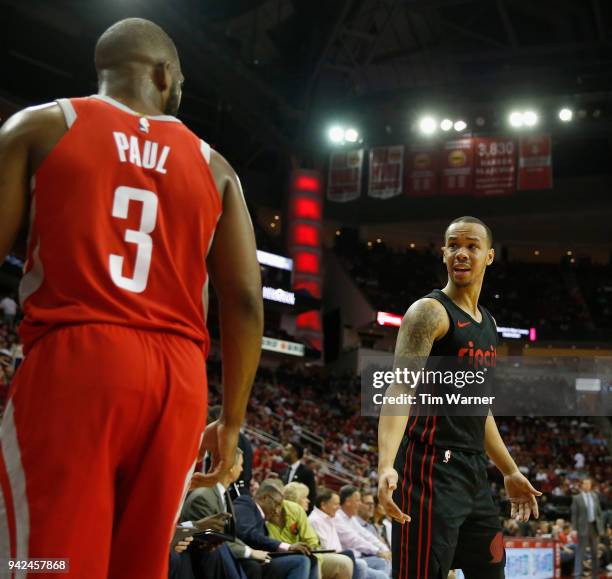 Shabazz Napier of the Portland Trail Blazers and Chris Paul of the Houston Rockets exchange words in the first half at Toyota Center on April 5, 2018...