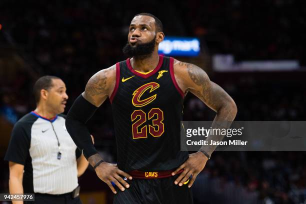LeBron James of the Cleveland Cavaliers reacts during the first half against the Washington Wizards at Quicken Loans Arena on April 5, 2018 in...