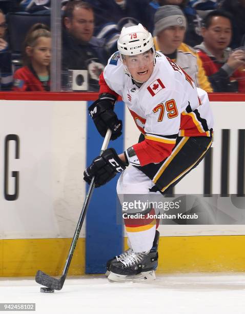 Micheal Ferland of the Calgary Flames plays the puck down the ice during first period action against the Winnipeg Jets at the Bell MTS Place on April...