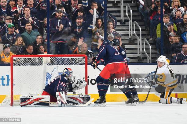 Conor Sheary of the Pittsburgh Penguins scores on goaltender Sergei Bobrovsky of the Columbus Blue Jackets during the third period of a game on April...