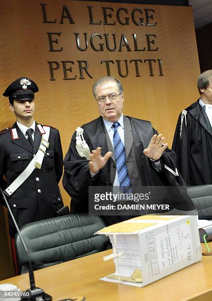 President Giuseppe Casalbore arrives in the courtroom on the first day of trial of two-former Eternit executives, on December 10, 2009 in Turin....