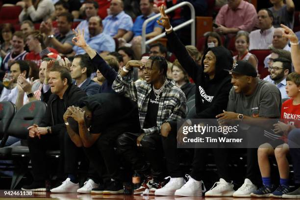 Rapper Travis Scott and Deshaun Watson of the Houston Texans celebrate a three point shot duing the first half of the game between the Houston...