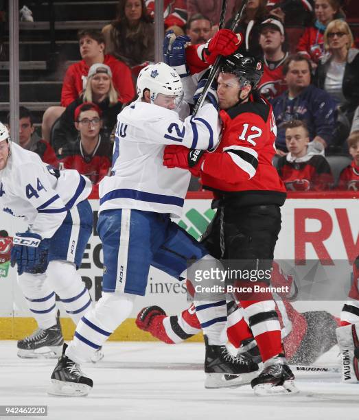 Patrick Marleau of the Toronto Maple Leafs and Ben Lovejoy of the New Jersey Devils battle during the third period at the Prudential Center on April...