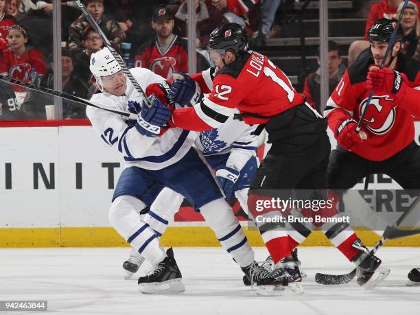 Patrick Marleau of the Toronto Maple Leafs and Ben Lovejoy of the New Jersey Devils battle during the third period at the Prudential Center on April...