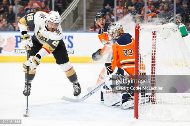 Goaltender Cam Talbot of the Edmonton Oilers shuts the door on William Carrier of the Vegas Golden Knights at Rogers Place on April 5, 2018 in...