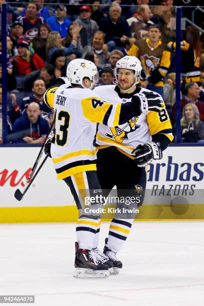 Conor Sheary of the Pittsburgh Penguins is congratulated by Sidney Crosby of the Pittsburgh Penguins after scoring a goal during the third period of...