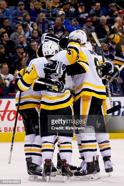 Conor Sheary of the Pittsburgh Penguins is congratulated by his teammates after scoring the game tying goal during the third period of the game...