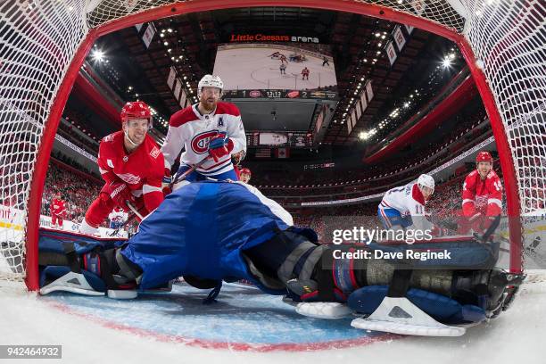 Goaltender Antti Niemi of the Montreal Canadiens makes a save as teammates Jeff Petry and Brendan Gallagher defend against Justin Abdelkader and...