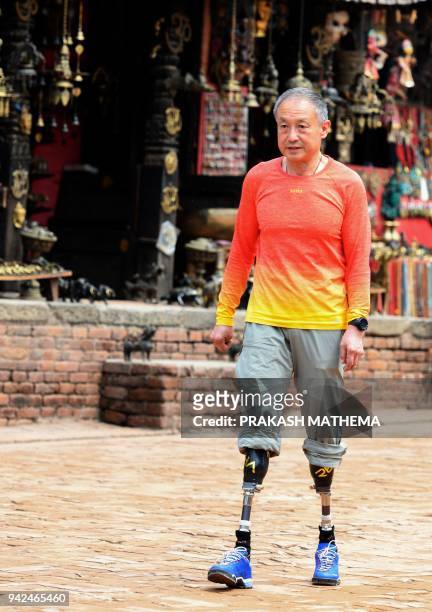 This photograph taken on April 4, 2018 shows Chinese double amputee climber Xia Boyu, who lost both of his legs during first attempt to climb...