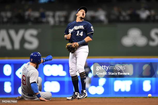 Ben Zobrist of the Chicago Cubs is safe at second base after an error by Hernan Perez of the Milwaukee Brewers during the fifth inning at Miller Park...