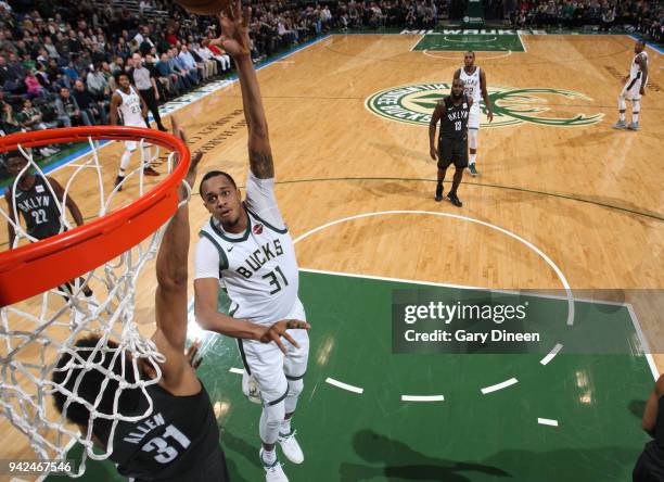 John Henson of the Milwaukee Bucks dunks against the Brooklyn Netson April 5, 2018 at the BMO Harris Bradley Center in Milwaukee, Wisconsin. NOTE TO...