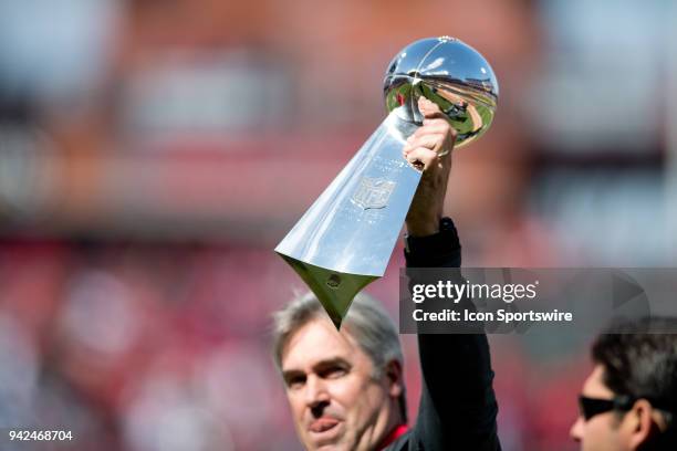 Philadelphia Eagles Head Coach Doug Pederson shows off the Lombardi Trophy before the game between the Miami Marlins and Philadelphia Phillies on...