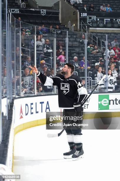 Nate Thompson of the Los Angeles Kings tosses a puck to a fan before a game against the Minnesota Wild at STAPLES Center on April 5, 2018 in Los...