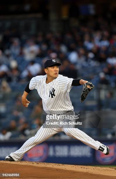 Masahiro Tanaka of the New York Yankees delivers a pitch against the Baltimore Orioles during the second inning of a game at Yankee Stadium on April...