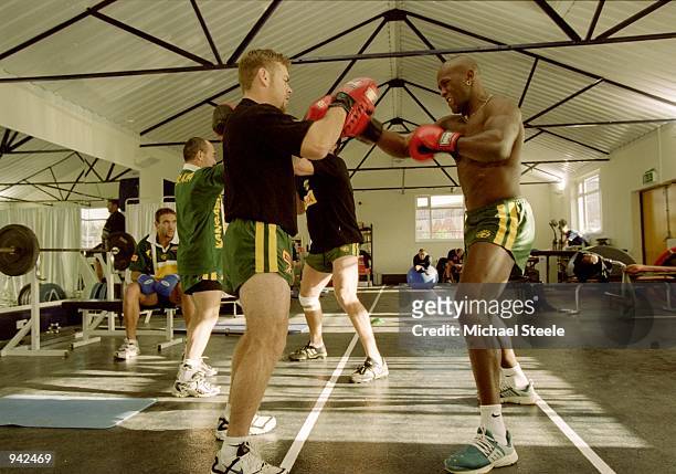 Brett Kimmorley and Wendell Sailor of Australia practice boxing in the gym during a Australia training session before the Rugby League World Cup held...