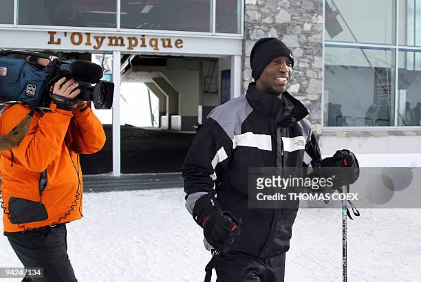 Track and field Olympic and world champion Michael Johnson arrives to attend a training session for the FIS ski World Cup Super G race, in Val...