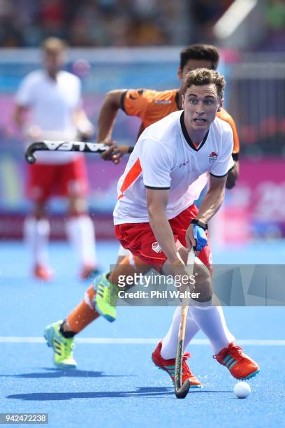 Harry Martin of England runs the ball forward in the Mens Hockey match between England and Malaysia on day two of the Gold Coast 2018 Commonwealth...