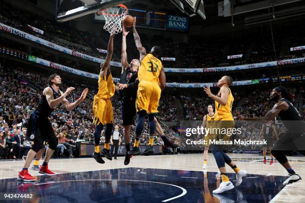 Sam Dekker of the LA Clippers shoot the ball blocked by Ekpe Udoh of the Utah Jazz during the game between the two teams on April 5, 2018 at...